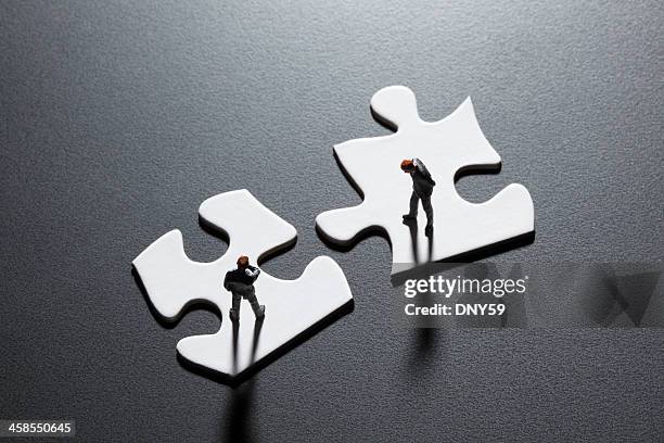 problem solving - fusies en overnames stockfoto's en -beelden