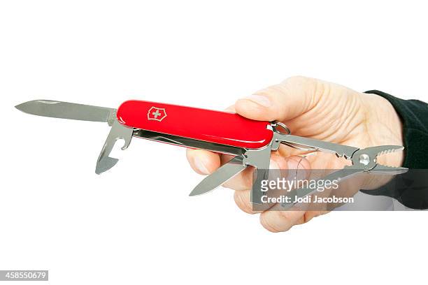 demonstration of a swiss army knife - penknife stock pictures, royalty-free photos & images