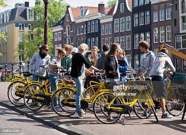 group of students plus teacher on a city bike tour - field trip stock pictures, royalty-free photos & images