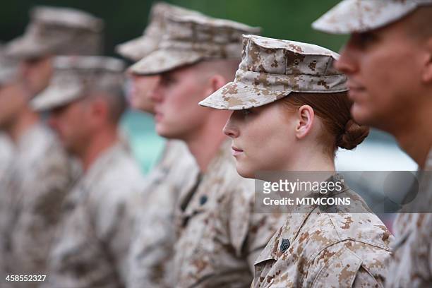 red haired woman marine in formation - us marine corps stock pictures, royalty-free photos & images