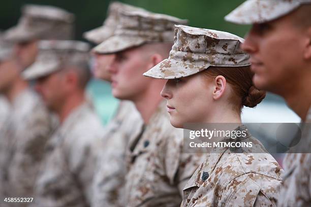 red haired woman marine in formation - gi stock pictures, royalty-free photos & images