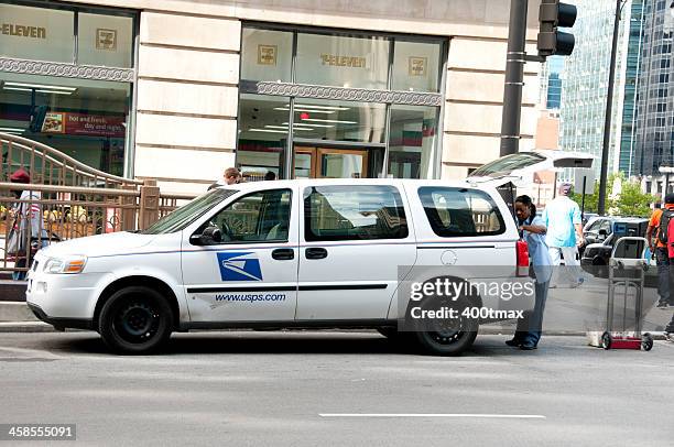 usps carrier unloading a van - auto post production filter stockfoto's en -beelden