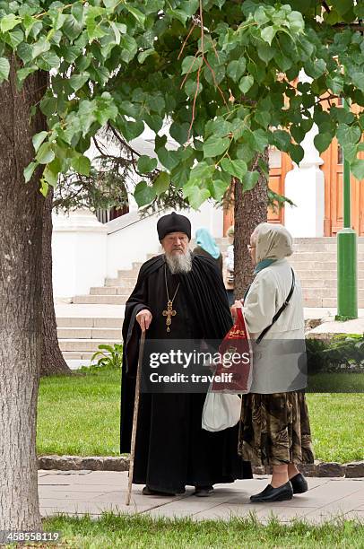 dialogues in russia - russian orthodox priest and parishioner - vicar stock pictures, royalty-free photos & images