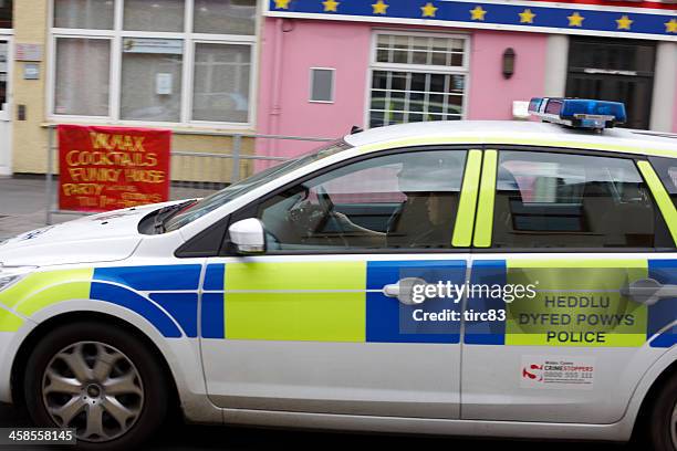 dyfed powys police car speeding past - powys stock pictures, royalty-free photos & images