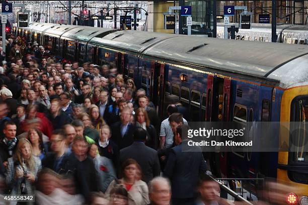 Passengers disembark a train at King's Cross station on November 7, 2014 in London, England.