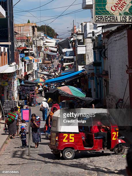 tuk-tuk taxi in the streets of chichicastenango, guatemala - chichicastenango bildbanksfoton och bilder