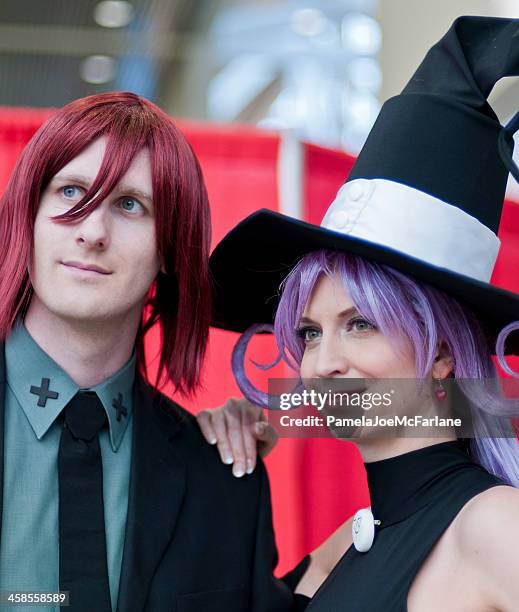 cosplayers dressed as death scythe and blair from soul eater - anime cosplay stock pictures, royalty-free photos & images