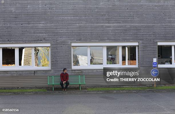 Man sits outside the ESAT project, an initiative to facilitate the integration into the mainstream labour market for people with disabilities, in...