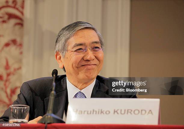 Haruhiko Kuroda, governor of the Bank of Japan , reacts at the International Symposium of the Bank of France policy conference in Paris, France, on...