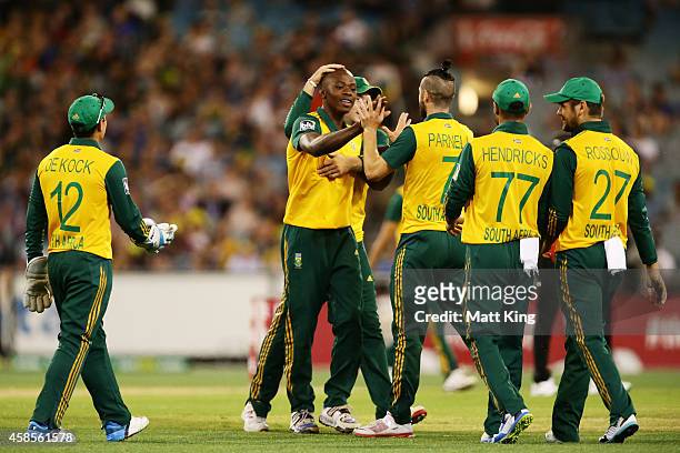 Kagiso Rabada of South Afric celebrates with team mates after taking the wicket of Glenn Maxwell of Australia during game two of the International...