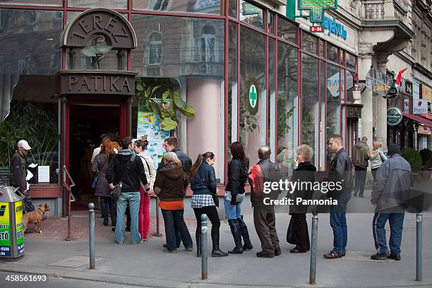 Queue In House Queue Of People Outside House Photos and Premium High Res Pictures ...