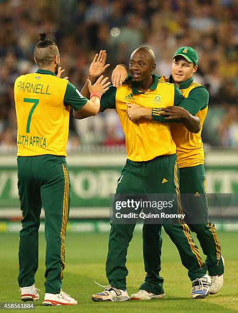 Kagiso Rabada of South Africa is congratulated by team mates after taking the wicket of Glenn Maxwell of Australia during game two of the...