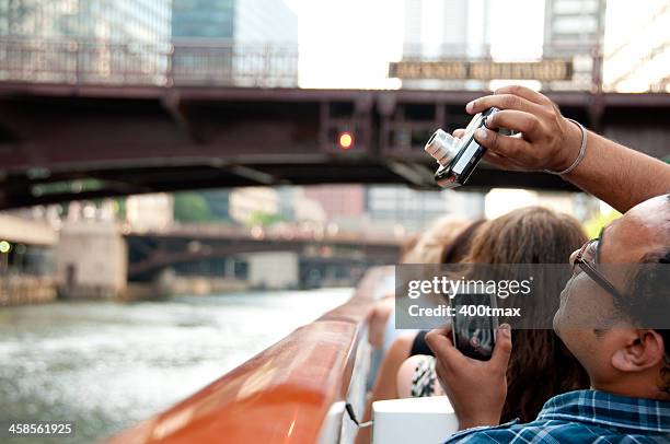 man with a camera in each hand - tourboat stock pictures, royalty-free photos & images