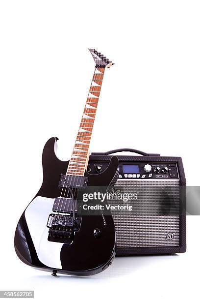 electric guitar and amplifier - electric guitar stock pictures, royalty-free photos & images