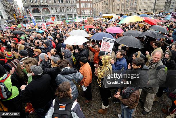 multi-ethnic crowd participating in an anti-racism protest - dam square stock pictures, royalty-free photos & images