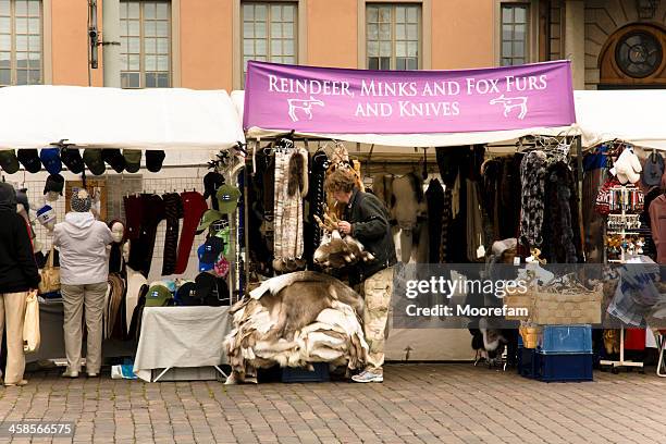 market stall in helsinki and salesman - mink fur stock pictures, royalty-free photos & images