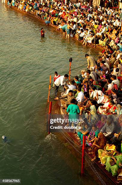 bathing in ganges river - haridwar stock pictures, royalty-free photos & images