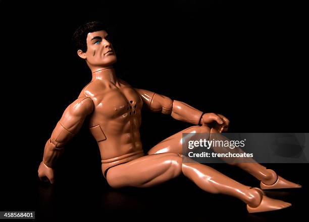 action man figure posing naked isolated on black background - action figures stock pictures, royalty-free photos & images