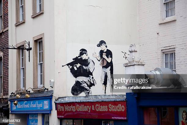 banksy graffiti in central bristol - banksy art stock pictures, royalty-free photos & images