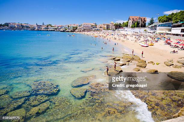 beach in cascais, portugal on a hot summer day - cascais stock pictures, royalty-free photos & images
