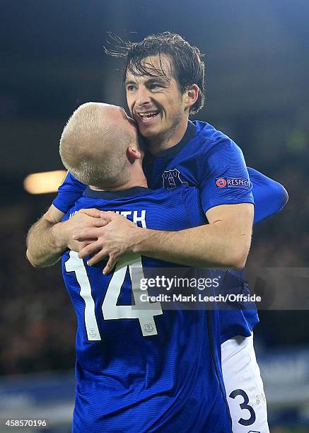 Steven Naismith of Everton celebrates with teammate Leighton Baines after scoring their 3rd goal during the UEFA Europa League Group H match between...