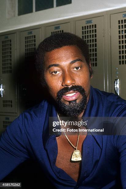 Player Wilt Chamberlain sits in the locker room before Sugar Ray Robinson's Celebrity Basketball game in April, 1975 at Beverly Hills High School in...