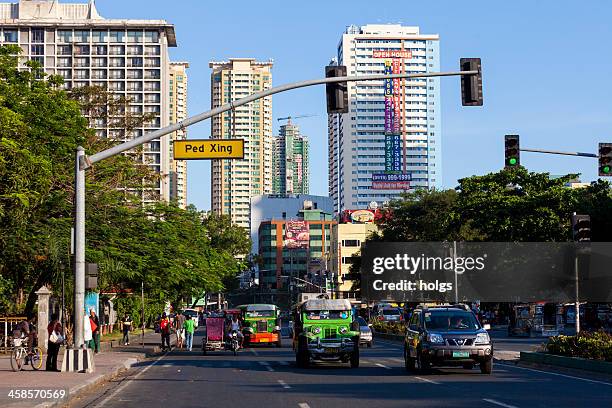 manila, philippines - jeepenys at the lights - philippines jeepney stock pictures, royalty-free photos & images
