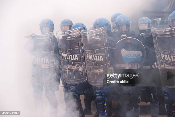 police in tear gas - police tear gas stock pictures, royalty-free photos & images