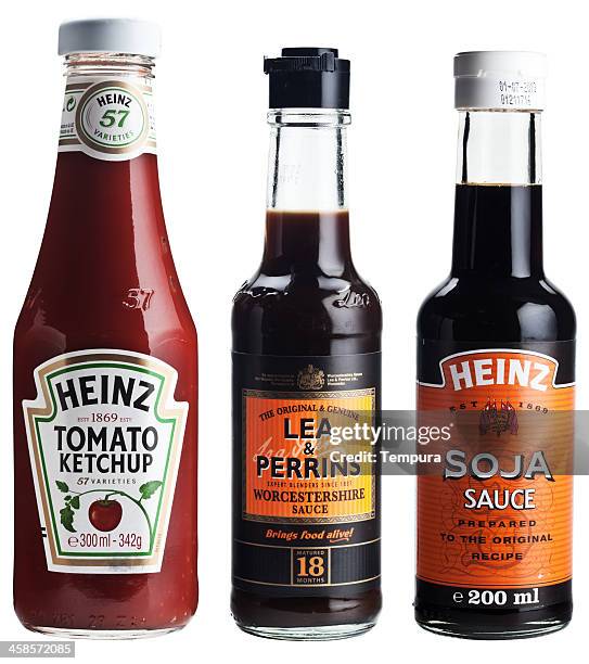 three bottles of popular sauces. - heinz ketchup bottle stock pictures, royalty-free photos & images