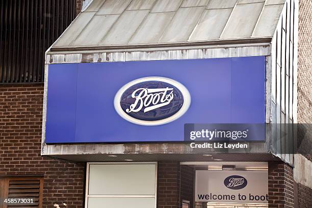 sign on canopy of a boots shop in glasgow. - boots pharmacy stock pictures, royalty-free photos & images