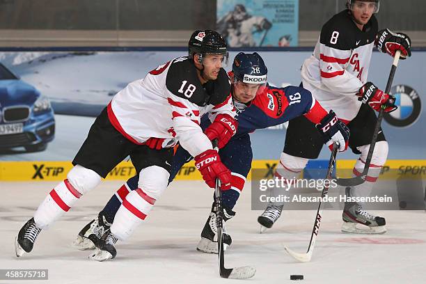 Jared Aulin of Canada skate against Juraj Valach of Slovakia during match 1 of the Deutschland Cup 2014 between Canada and Slovakia at Olympia...