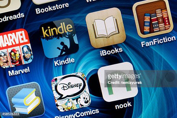 reading applications on iphone 4 screen - nook e reader stock pictures, royalty-free photos & images