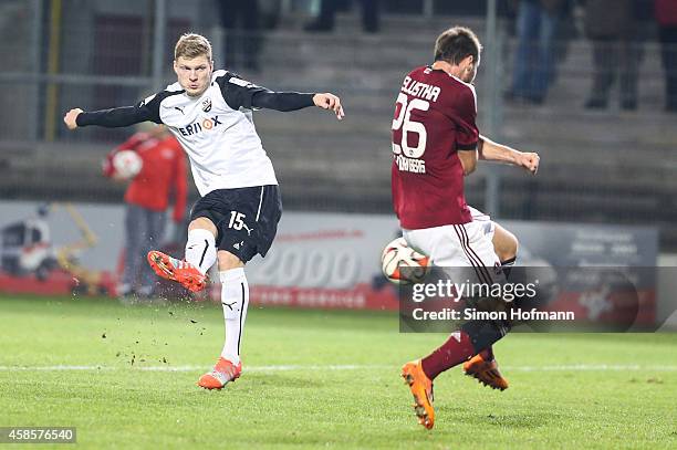 Alexander Bieler of Sandhausen scores his team's first goal against Ondrej Celustka of Nuernberg during the Second Bundesliga match between SV...