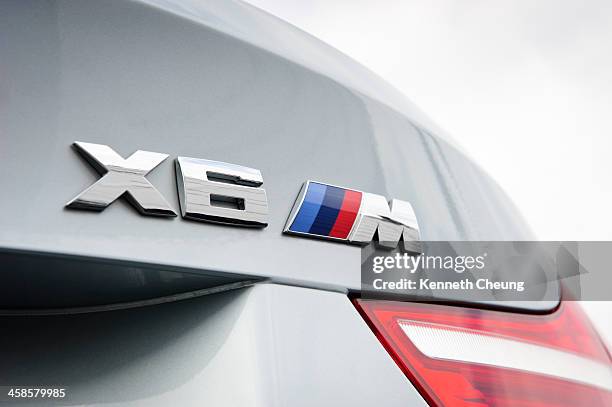 bmw x6 m rear badge - bmw x6 m stock pictures, royalty-free photos & images