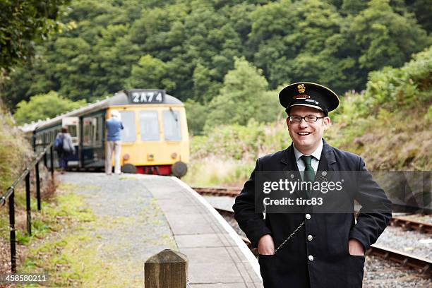 ticket collector at preserved uk railway - railroad conductor stock pictures, royalty-free photos & images