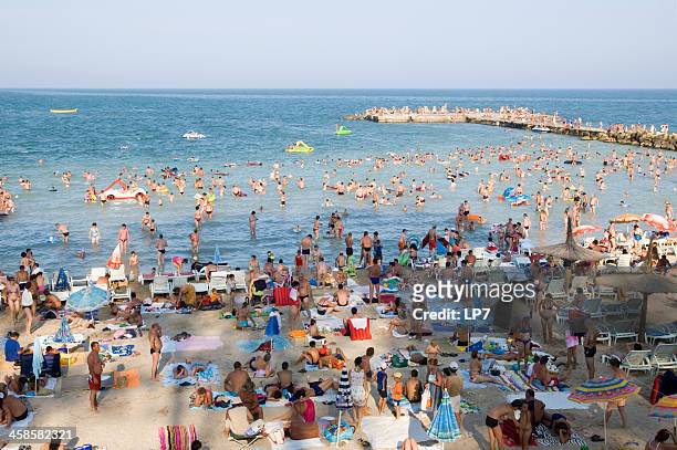 crowded beach on the black sea - romania beach stock pictures, royalty-free photos & images