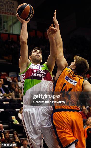 Tornike Shengelia, #7 of Laboral Kutxa Vitoria competes with Luke Harangody, #44 of Valencia Basket in action during the 2014-2015 Turkish Airlines...