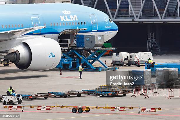 klm plane being serviced at schiphol airport - hangar stockfoto's en -beelden