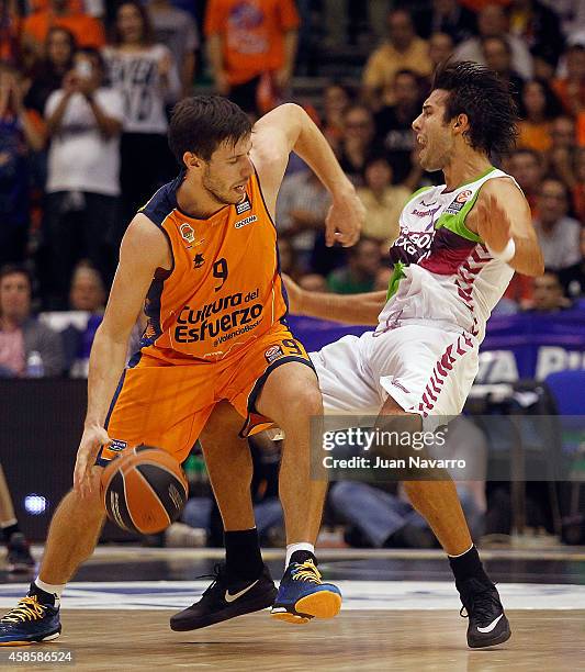 Sam Van Rossom, #9 of Valencia Basket competes with Sasha Vujavic of Laboral Kutxa Vitoria in action during the 2014-2015 Turkish Airlines Euroleague...