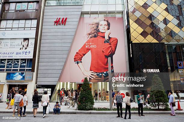 h&m in ginza, tokyo, japan - designer label stock pictures, royalty-free photos & images
