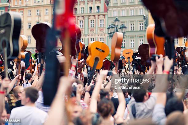 crowd of guitar players - wroclaw stock pictures, royalty-free photos & images