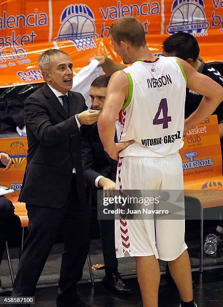 Marco Crespi, Head Coach of Laboral Kutxa Vitoria and Colton Iverson, #4 of Laboral Kutxa Vitoria in action during the 2014-2015 Turkish Airlines...