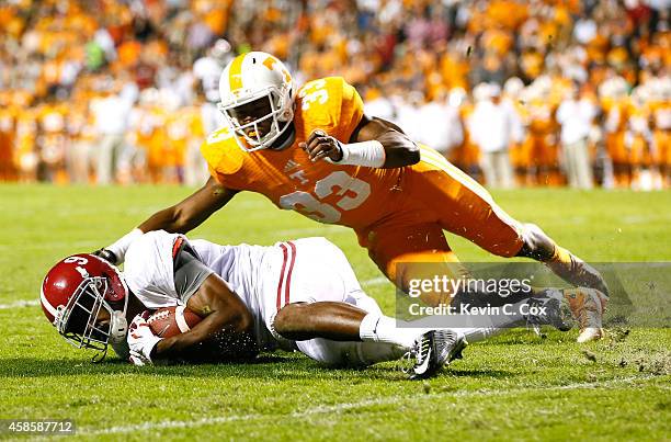 Amari Cooper of the Alabama Crimson Tide pulls in this reception against LaDarrell McNeil of the Tennessee Volunteers at Neyland Stadium on October...