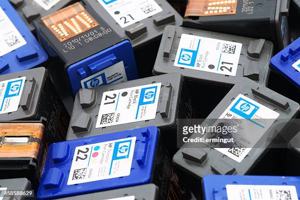 close-up of used hewlett-packard ink cartridges - cartridge stock pictures, royalty-free photos & images
