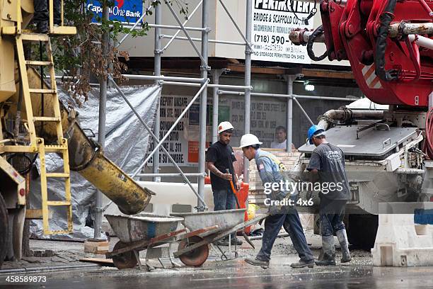 construction workers at a building site - crane construction machinery stock pictures, royalty-free photos & images