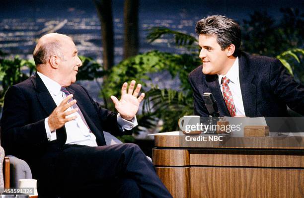 Pictured: Author Clive James during an interview with guest host Jay Leno on May 1, 1990 --