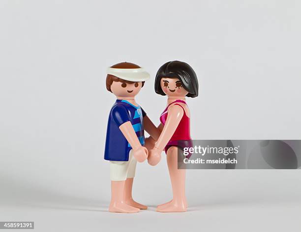 playmobil couple, man and women holding hands - playmobil stock pictures, royalty-free photos & images