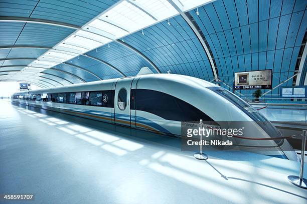 futuristic high-speed train in china - bullet train stock pictures, royalty-free photos & images