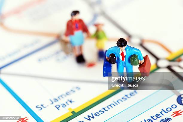 travelers in london - tube map stock pictures, royalty-free photos & images