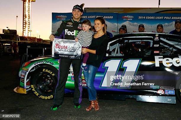 Denny Hamlin, driver of the FedEx Ground Toyota, his girlfriend Jordan Fish, and his daughter, Taylor James Hamlin, pose with the Coors Light Pole...